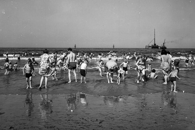 Trades holidaymakers taking to the water at Portobello Beach in July 1958.