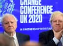 Boris Johnson and broadcaster and conservationist David Attenborough at the launch of the United Nations' Climate Change conference, Cop26, in London in February last year (Picture: Jeremy Selwyn/pool/AFP via Getty Images)