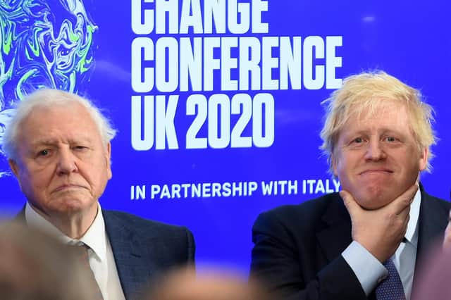 Boris Johnson and broadcaster and conservationist David Attenborough at the launch of the United Nations' Climate Change conference, Cop26, in London in February last year (Picture: Jeremy Selwyn/pool/AFP via Getty Images)