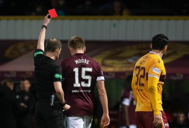 Taylor Moore is given his marching orders after earning a second yellow card. Picture: SNS