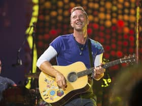 FILE - Chris Martin of Coldplay performs at Metlife Stadium on Aug. 1, 2017, in East Rutherford, N.J.  Coldplay's latest album, Music of the Spheres, releases Oct. 15.  (Photo by Scott Roth/Invision/AP, File)