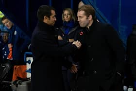 Rangers manager Giovanni van Bronckhorst and Hearts manager Robbie Neilson shake hands pre-match at Ibrox.
