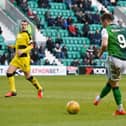 Marc McNulty scores for Hibs against Raith in the lat competitive meeting between the two sides as Iain Davidson, right, looks on