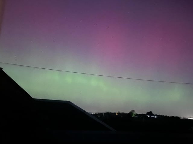 Pink, purple and green hues shone in the skies above Linlithgow in West Lothian.