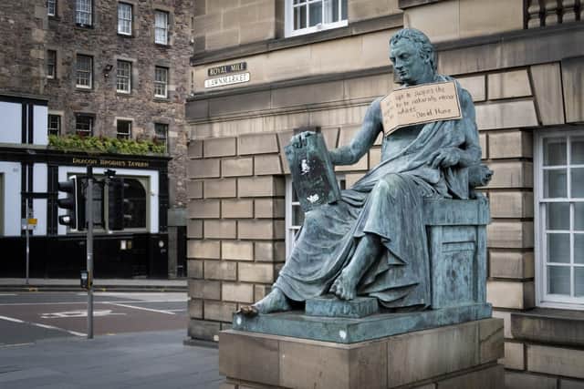 A poster hangs from the statue of the 18th Century philosopher David Hume on the Royal Mile, Edinburgh, following the Black Lives Matter protest rally on June 7, 2020, in Holyrood Park, Edinburgh, in memory of George Floyd who was killed on May 25 while in police custody in the US city of Minneapolis. (Image credit: Jane Barlow/PA Wire)