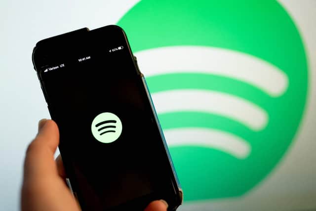 This illustration photo shows the Spotify logo 
(Photo by Stefani Reynolds / AFP) (Photo by STEFANI REYNOLDS/AFP via Getty Images)