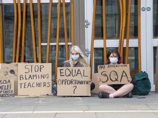 Pupils protesting outside the Scottish Parliament over exams    Picture: Lisa Ferguson





COVID 19  - A COUPLE OF STUDENTS PROTEST OUTSIDE THE SCOTTISH PARLIAMENT THIS AFTERNONN WITH REGARDS TO EXAMS