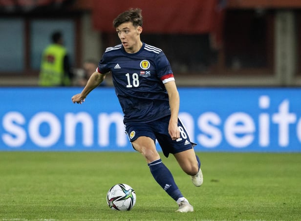 Aaron Hickey in action for Scotland.