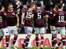 Hearts players celebrate Lawrence Shankland (second left) scoring his hat-trick goal in the dominant win over Ross County. Picture: SNS