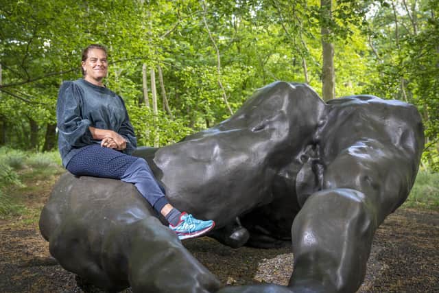 Artist Tracey Emin with her new six metre bronze sculpture 'I Lay Here For You', the latest permanent work at Jupiter Artland sculpture park in Edinburgh. Picture: Jane Barlow/PA Wire