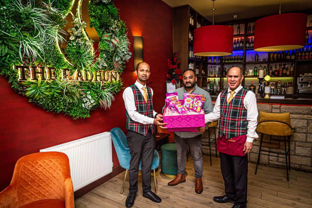 Habibur Khan with Radhuni waiting staff Azharul Jalil and Syed Urshad Ali. Photo by Gavin Hill.