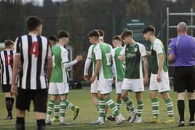 Reuben McAllister (far left), Jacob MacIntyre, and Josh Landers (far right) congratulate Jay McGarva after his second goal won the game for Hibs. Picture: Maurice Dougan