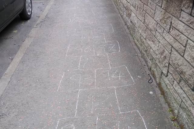 The hopscotch game stretches way up the pavement towards Bruntsfield Place.