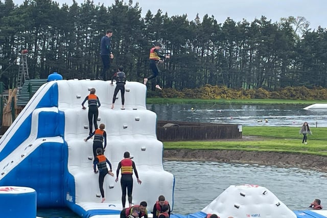 This visitor makes a jump for it during the opening weekend of the Aqua Park at Foxlake Adventures.