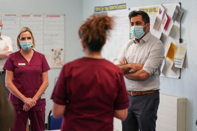 Humza Yousaf talks to staff during a visit at Liberton Hospital on January 11, 2022 in Edinburgh. Photo by Peter Summers/Getty Images