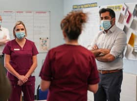 Humza Yousaf talks to staff during a visit at Liberton Hospital on January 11, 2022 in Edinburgh. Photo by Peter Summers/Getty Images