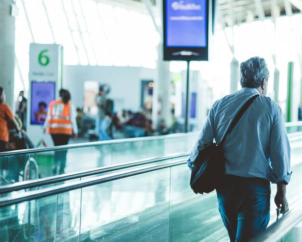 Person walks through airport terminal building
