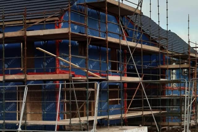 Homes under construction. Photo (stock image)