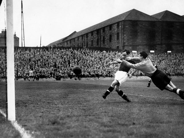 Bobby Flavell scoring for Hearts at Tynecastle on August 18 1948.  Bobby eventually left Hearts and the country to play out in Bogota. You can see the uncovered terracing with the North British Distillery warehouse buildings behind, this section was covered during construction works in the 1950s.