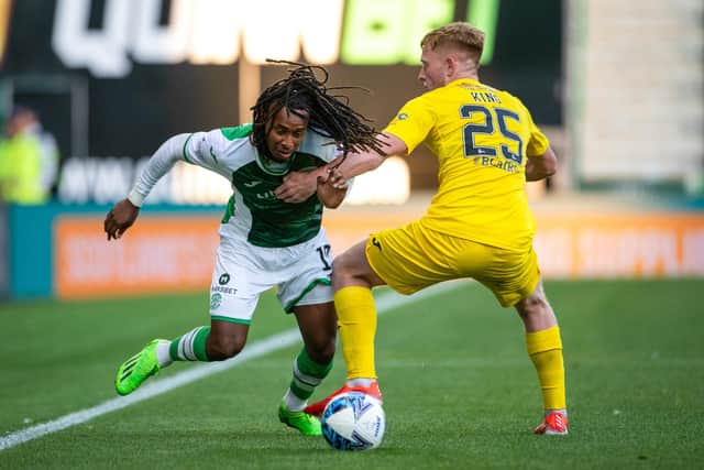 Hibs substitute Jair Tavares runs at Alexander King during the second half of the Premier Sports Cup tie with Morton at Easter Road. Picture: SNS