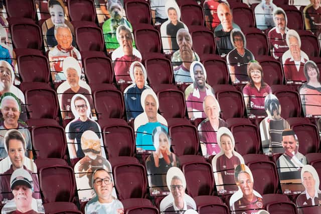 Cutouts of Hearts fans sit in the stands during a Betfred Cup match against Inverness Caledonian Thistle at Tynecastle Park.