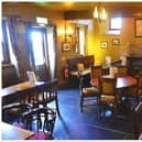 Two teenagers have been charged following break-ins at Edinburgh pub The Cramond Inn (pictured) and a shop in the city centre.