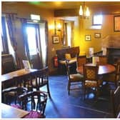 Two teenagers have been charged following break-ins at Edinburgh pub The Cramond Inn (pictured) and a shop in the city centre.