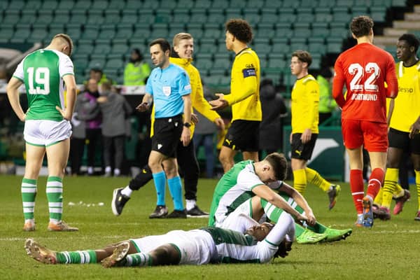 Dejection for Rudi Molotnikov, Kanayo Megwa, and Jacob MacIntyre after Dortmund's late show at Easter Road