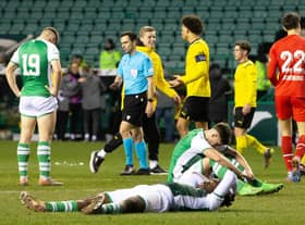 Dejection for Rudi Molotnikov, Kanayo Megwa, and Jacob MacIntyre after Dortmund's late show at Easter Road