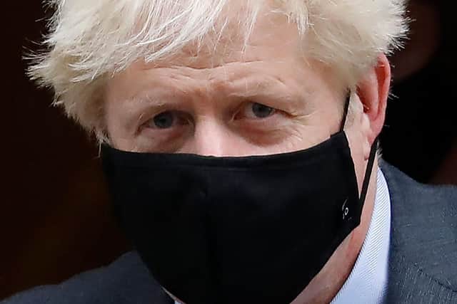 Boris Johnson never liked wearing a face mask. Picture:  Tolga Akmen/AFP