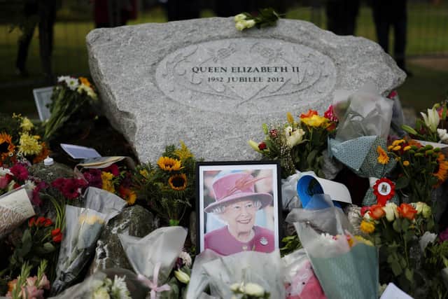 Floral tributes are left for the late Queen Elizabeth II on September 11, 2022 (Photo by Jeff J Mitchell/Getty Images)