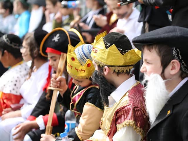 Jewish school children gather and sit in fancy dress during a schools' annual Purim event (Photo: Shutterstock)