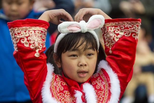 Little girl celebrates The Year of the Rabbit with traditional costume