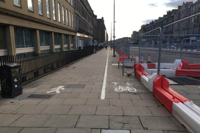 There was outrage from bike users last week when photos emerged showing the newly-created lane, which runs alongside the ongoing tram extension works, obstructed by street lamps and bins.