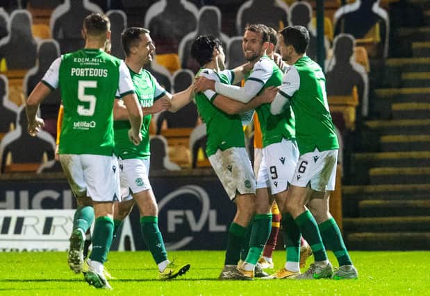 Happy Hibees: Christian Doidge takes the plaudits after netting the second goal against Motherwell