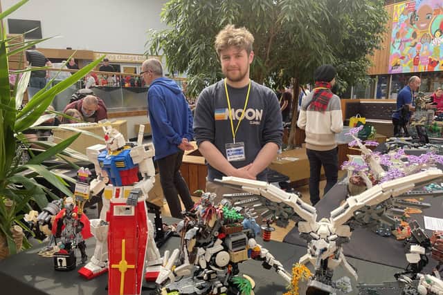 James Kavanagh with his many LEGO models based on fantastical robots and creatures.