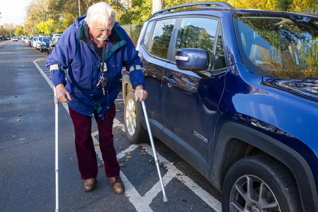 Mr Munro then has to manoeuvre himself and walk round the car    Picture: Lisa Ferguson