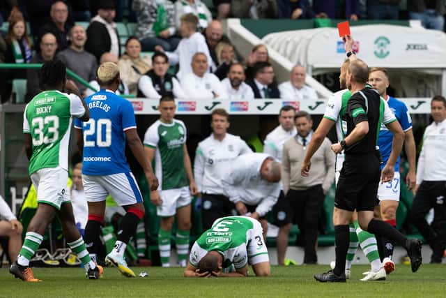 Referee Willie Collum shows a red card to Alfredo Morelos for swinging an elbow towards Marijan Cabraja. Picture: Alan Harvey / SNS Group)