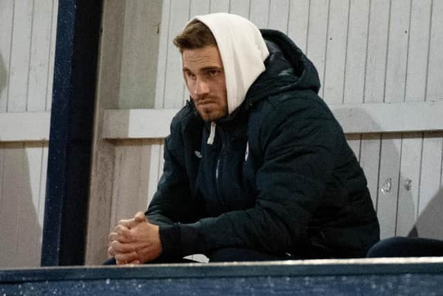 David Goodwillie watched Raith Rovers draw with Queen of the South at Stark's Park before the club confirmed his contract would be cancelled.