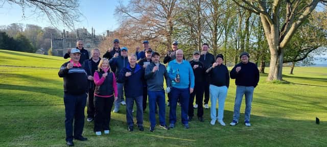 Members of Dalmeny Estate Golf Club toast the return of its captain v vice-captain match.