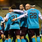 Hearts players celebrate as Euan Henderson's goal makes it 2-0 against Raith Rovers at Stark's Park. (Photo by Ross Parker / SNS Group)