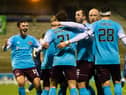 Hearts players celebrate as Euan Henderson's goal makes it 2-0 against Raith Rovers at Stark's Park. (Photo by Ross Parker / SNS Group)