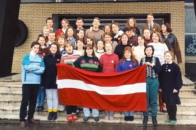 Rev Dr Urzula Glienecke as a student activist with the Latvian flag which had been banned under communism