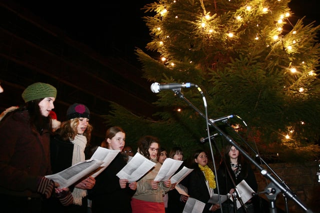 Carol singers at the turning on of the Christmas lights in the Grassmarket in November, 2007.