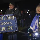Anti-Brexit campaigners take part in a torchlight procession to the Scottish Parliament on the third anniversary of Brexit on January 31 (Picture: Jeff J Mitchell/Getty Images)