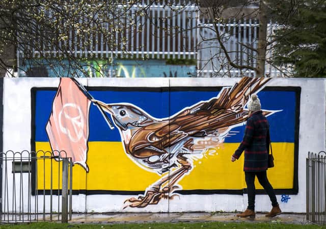 Solidarity: A new mural in Leith features a Nightingale, the official national bird of Ukraine, against the country's flag.  PIC: Jane Barlow/PA Wire