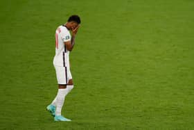 England's forward Marcus Rashford reacts after he fails to score in the penalty shootout during the UEFA EURO 2020 final football match between Italy and England at the Wembley Stadium in London. (Picture credit: John Sibley/Getty Images)