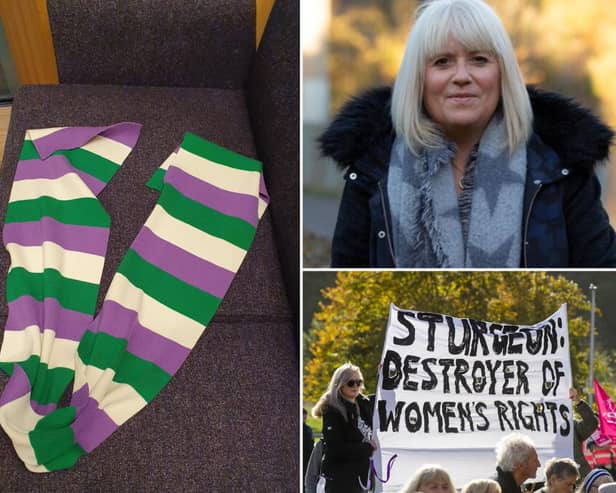 A row has broken out after a woman wearing a Suffragette scarf was removed from Scottish Parliament