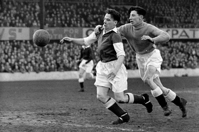 Hibs legend Lawrie Reilly scores after getting past keeper Billy Brown during a 4-2 win over Dundee in March 1950.