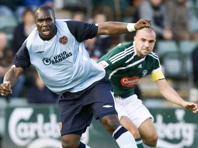 Former Hearts striker Christian Nade tries to move away from Plymouth's Carl Fletcher back in 2009, the last time the two clubs met in a friendly. Picture: SNS